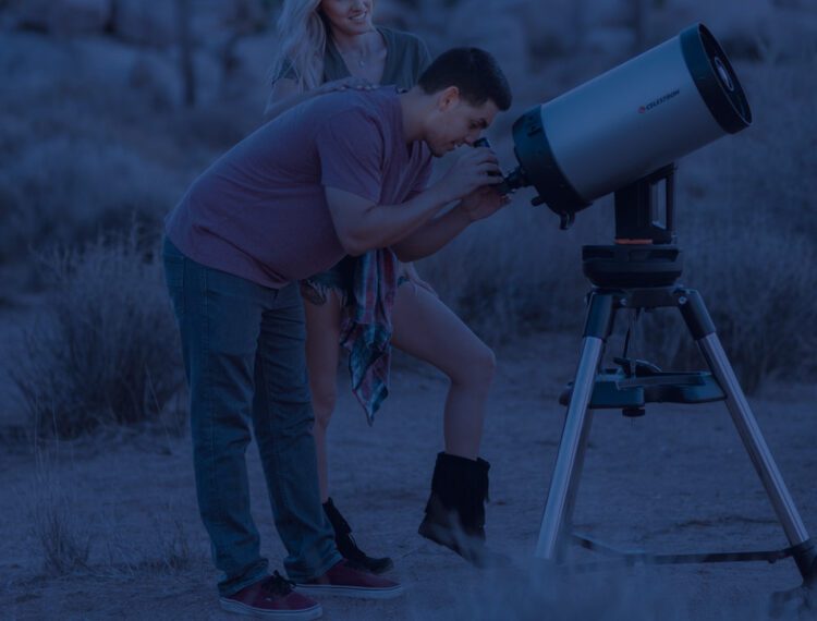 people looking through telescope