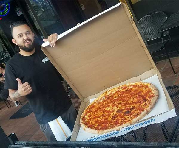 man with pizza in box