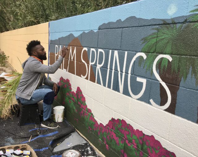 Tysen Knight painting a Palm Springs mural