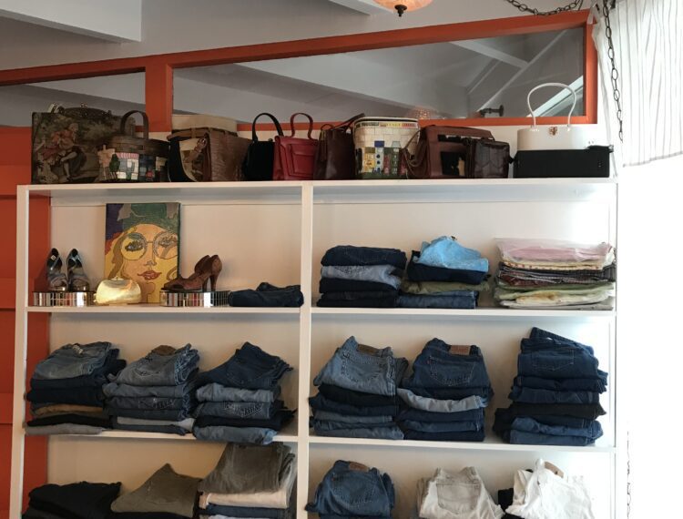 folded clothes on shelves