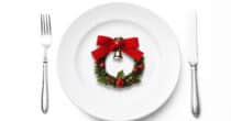 Overhead shot of place setting and Christmas Wreath, isolated on white background with clipping path.