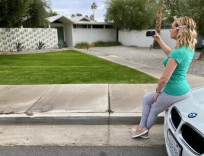 Woman on a Palm Springs architecture tour taking a picture