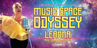 A promotional image for a "Music Space Odyssey" concert experience featuring a singer, Leanna, wearing a yellow ruffled top and singing into a vintage microphone, with cosmic space visuals and text announcing the event in the background.